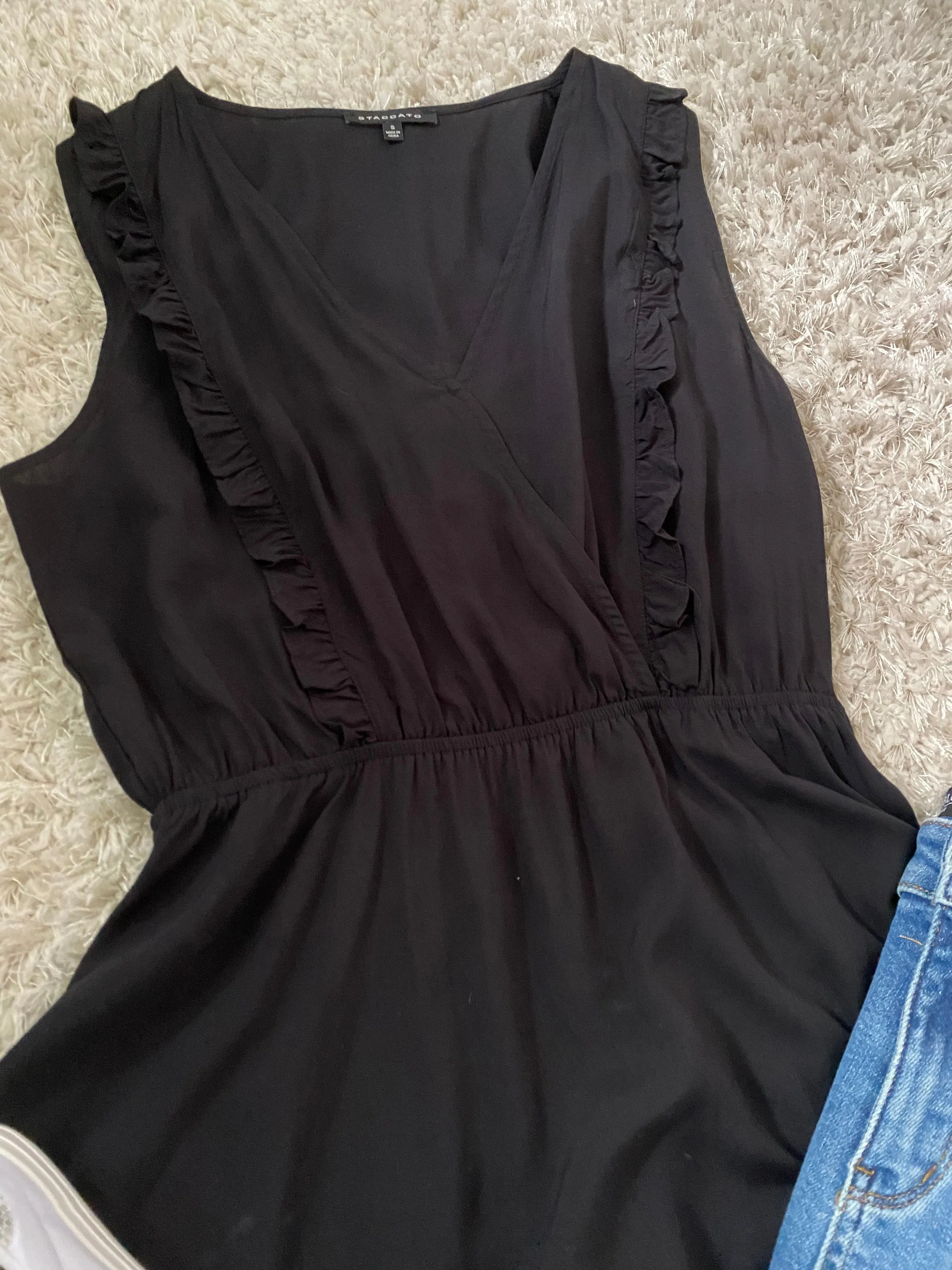 Black ruffle sleeveless top